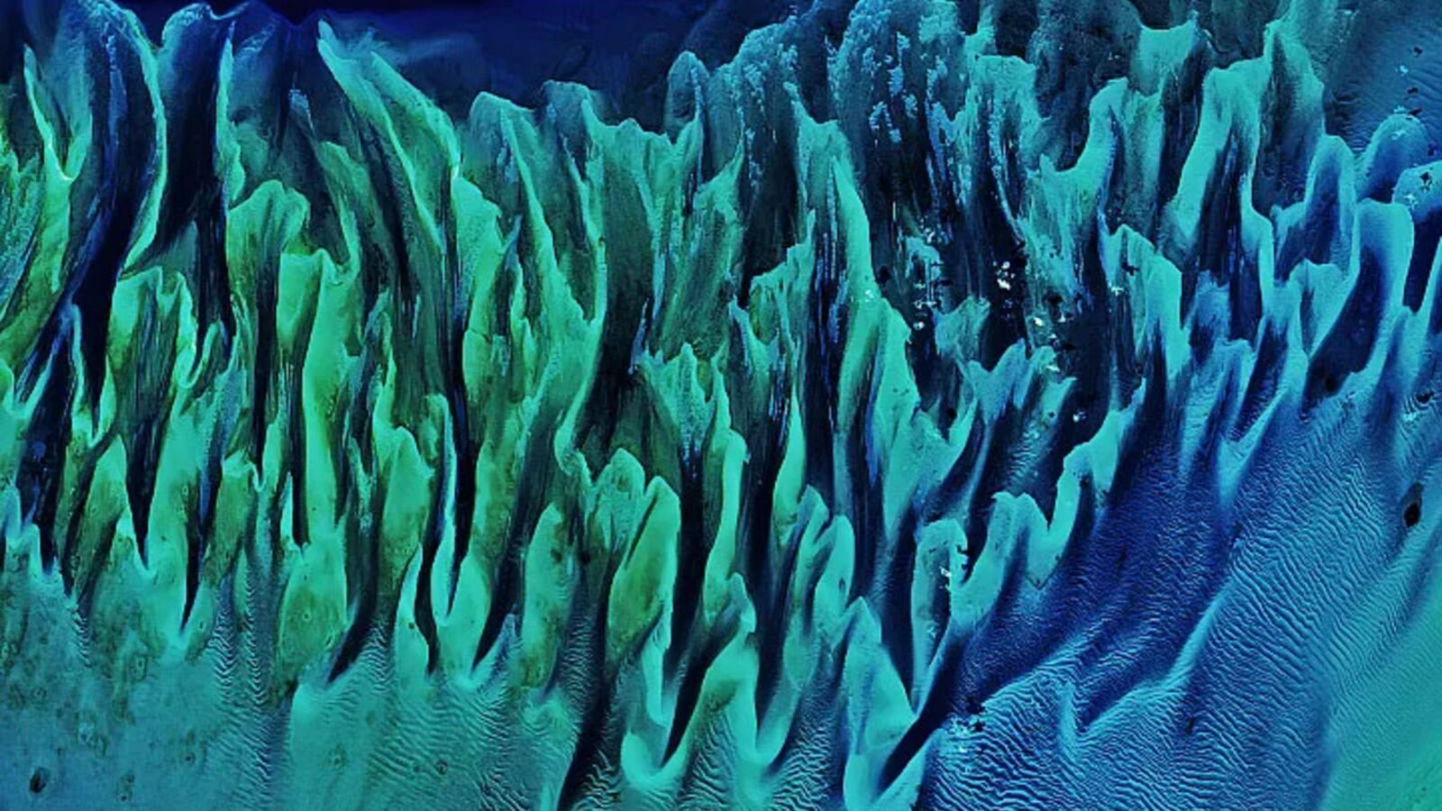 Tierra: Ondas de color sobre el fondo de Bahamas